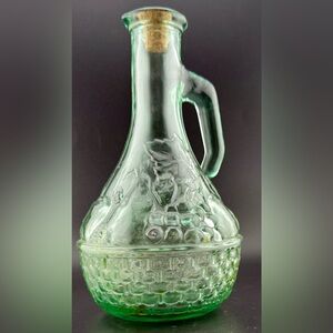 Green glass cruet w/ an embossed fruit & basket weave design.